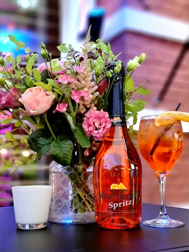 Spritz next to flowers